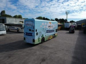 rear and side vehicle graphics bus wrap